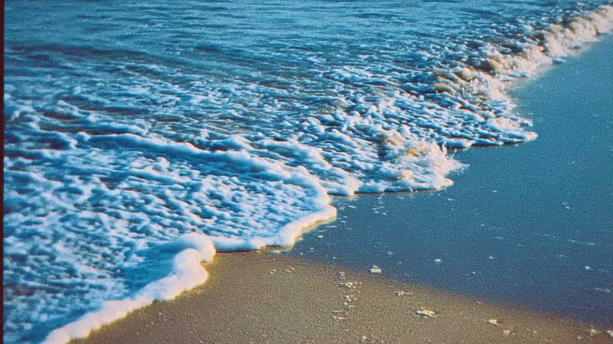 Ocean water moving across a quiet beach