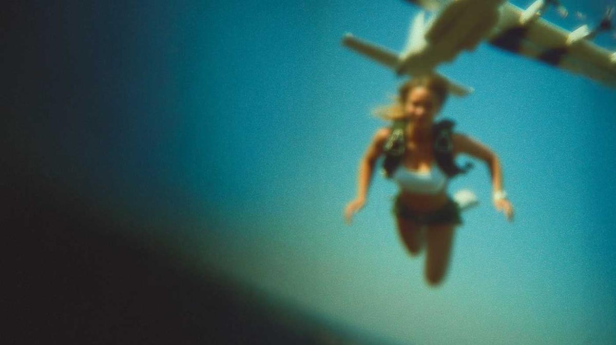 A skydiver committing to the jump